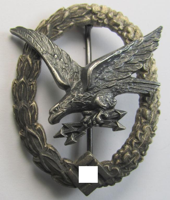Superb, WH (Luftwaffe) 'Fliegerschützen-Abzeichen mit Blitzbündel' being a clearly maker- (ie. 'Wilh. Deumer'-) marked and typically zinc- (ie. 'Feinzink'-) based example that comes as issued and/or moderately worn