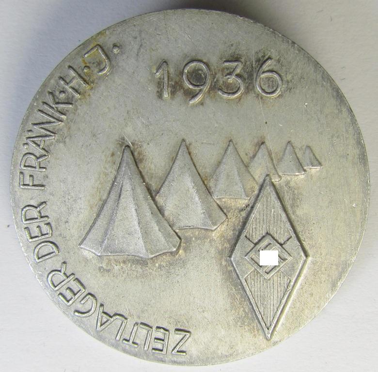 Commemorative, aluminium-based- and/or: greyish-silver-coloured, 'HJ'-related 'tinnie', being a non-maker-marked example, depicting a 'HJ-Raute' surrounded by the text: 'Zeltlager der Frank. H.J. - 1936'