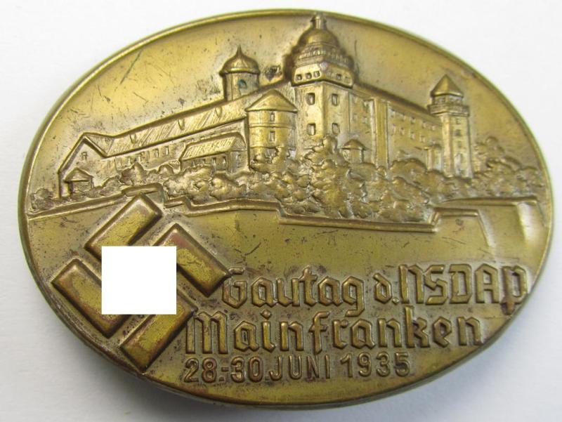 Commemorative, tin-based- and/or: golden-coloured, N.S.D.A.P.-related 'tinnie' being a non-maker marked example depicting a detailed illustration of a castle and bearing the text: 'Gautag d. NSDAP - Mainfranken - 28.30. Juni 1935'
