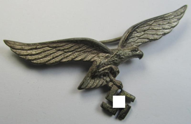 Attractive - and moderately used- ie. worn - WH (Luftwaffe) metal- (ie. 'Buntmetall'-) based breast-eagle as was intended for usage on the white summer-tunics (ie. 'Brustadler für LW Sommerrock') being a detailed- (albeit non-maker-marked-) specimen