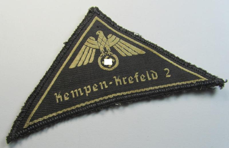 Attractive, German Red Cross (ie. 'Deutsches Rotes Kreuz' or 'DRK') greyish-coloured- and/or (typically) triangular-shaped arm-eagle entitled: 'Kempen-Krefeld 2' as was executed in the neat 'BeVo'-weave pattern