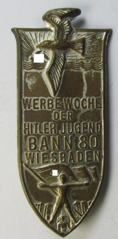 Attractive - and unusual! - HJ (ie.'Hitlerjugend') related 'tinnie' ie. 'Veranstaltungsabzeichen' being a non-maker-marked example showing a sunburst, sea-gull and HJ-flag-bearer and text: 'Werbewoche der Hitler Jugend - Bann 80 - Wiesbaden'