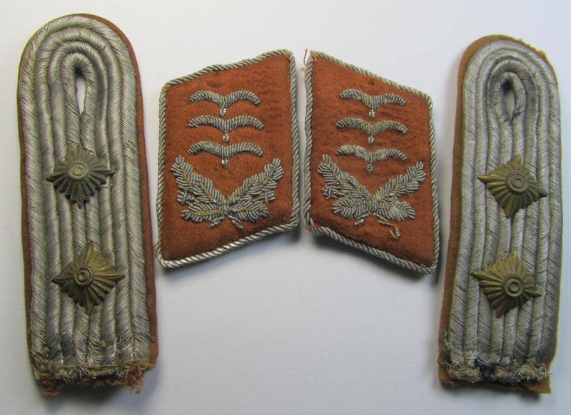 Moderately worn and fully matching, 4-pieced insignia-grouping comprising of a pair of WH (LW) officers'-type shoulderboards and dito collar-tabs as was intended for usage by a: 'Hauptmann u. Mitglied der Nachrichten-Truppen'