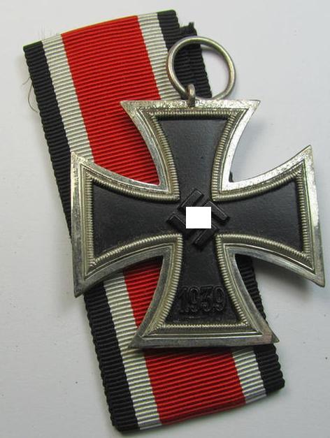 'Eisernes Kreuz II. Klasse' being a typical non-maker-marked example of the so-called: 'standard-design' and that comes with its original- and never-mounted ribbon (ie. 'Bandabschnitt')