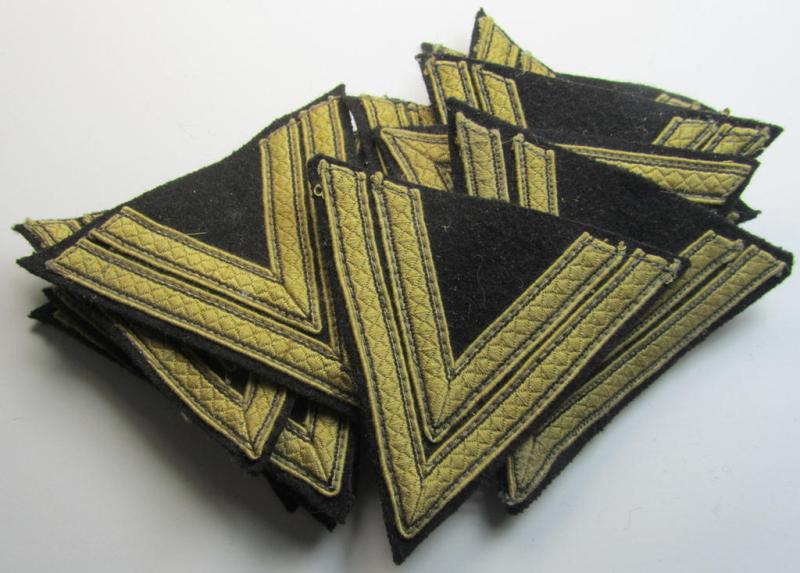 Waffen-SS-type 'Armwinkel' (or: rank-chevron) as executed on black-coloured wool as was specifically intended for usage by an SS-soldier with the rank of: 'SS-Rottenfï¿½hrer'