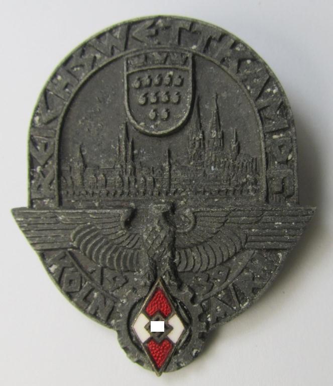Attractive - truly rarely found! - HJ- ie. BDM (ie. 'Hitlerjugend' or: 'Bund Deutscher Mädel') related day-badge (ie. 'tinnie') being a greyish-toned- and 'Feinzink-based example issued to commemorate the: 'Reichswettkampf - Köln a. Rh. - 1939'