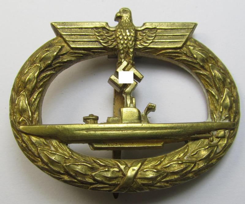 Superb, WH (Kriegsmarine) 'U-Bootkriegsabzeichen' being a maker- (ie. 'Schwerin - Berlin 68'-) marked example as executed in bright-golden-toned 'Buntmetall' (ie. 'Tombak') as was produced by the maker (ie. 'Hersteller'): 'Schwerin'