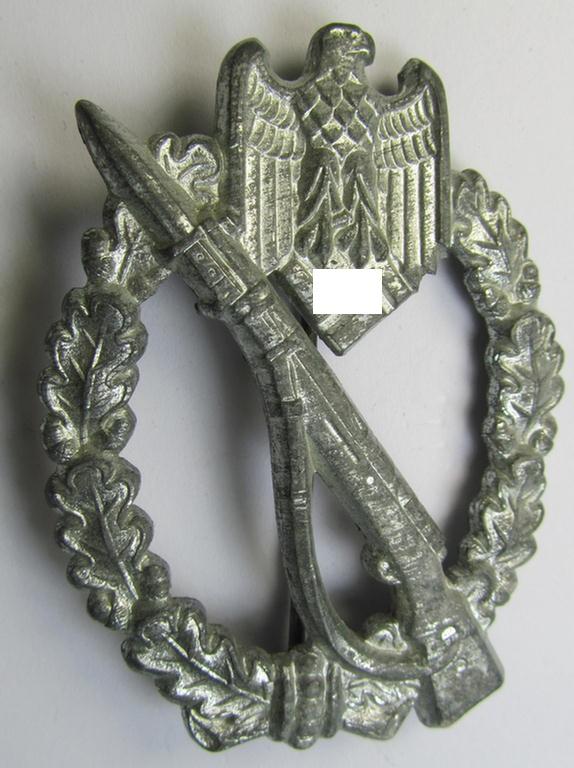 'Infanterie-Sturmabzeichen in Silber' (or: silver-class IAB) being a clearly maker- (ie. 'GWL'-) marked, zinc- (ie. 'Feinzink'-) version ie. molded-'variant' as was procuded by the: 'Gebrüder Wegerhoff'-company