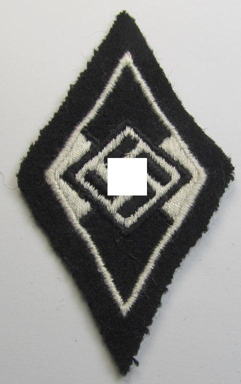 Waffen-SS-pattern, machine-embroidered and/or black- and white-coloured sleeve-insignia (ie. 'Ärmelraute') depicting a so-called: 'HJ-Raute' as was used and intended to signify former membership within the 'Hitlerjugend'