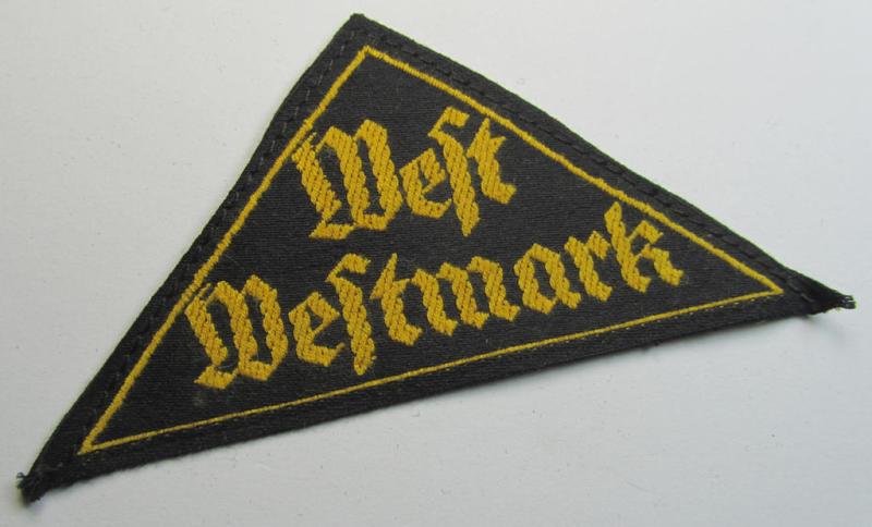 Neat, HJ/BDM ('Hitlerjugend' ie.: 'Bund Deutscher Mädel') district-triangle (ie. 'Gebietsdreieck') entitled: 'West Westmark' (being a 'virtually mint- ie. unissued' example that still retains its period-attached 'RzM'-etiket)