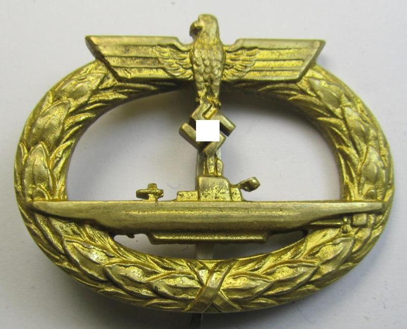 Superb, later-period WH (Kriegsmarine) 'U-Bootkriegsabzeichen' being a non-maker-marked example as executed in bright-golden-toned 'Buntmetall' (ie. 'Tombak') as was produced by the maker (ie. 'Hersteller'): 'Schwerin'