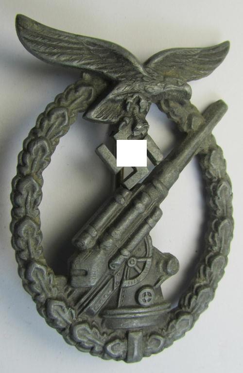 Period-repaired, later-war period- and/or: zinc- (ie. 'Feinzink'-) based- example of a non-maker-marked, WH (Luftwaffe) 'Flakkampfabzeichen' (or: airforce anti-aircraft badge), as was produced by a (by me) unidentified maker