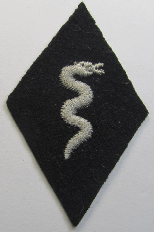 Waffen-SS-pattern, machine-embroidered and/or black- and white-coloured sleeve-insignia (ie. 'Ärmelraute') depicting a so-called: 'HJ-Raute' as was used and intended to signify membership within the 'SS-Veterinärsdienst'
