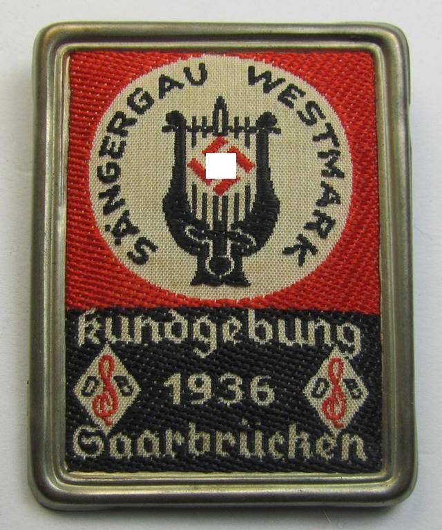 Commemorative - tin- (ie. linnen-) based 'tinnie' being a maker- (ie. 'Kruse & Söhne'-) marked example depicting a 'sunburst' with swastika and text that reads: 'Kundgebung Sängergau Westmark - Saarbrücken 1936'