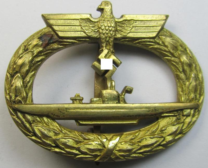 Superb, mid-period WH (Kriegsmarine) 'U-Bootkriegsabzeichen' being a maker- (ie. 'Schwerin'-) marked example as executed in bright-golden-toned 'Buntmetall' (ie. 'Tombak') as was produced by the maker (ie. 'Hersteller'): 'Schwerin'