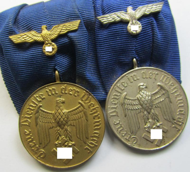 Attractive, two-pieced medal-bar (ie. 'Spange') showing two: WH (Heeres or Kriegsmarine) so-called: 'Dienstauszeichnungen für 4 u. 12 Jahre Treue Dienste' that both come period-mounted as a so-called: 'Doppelspange'