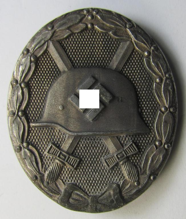 Attractive - and just moderately used- and worn! - example of a maker- (ie. '65'-) marked example of a silver-class wound-badge (or: 'Verwundeten-Abzeichen in Silber') as was produced by the 'Hersteller' ie. maker: 'Klein u. Quenzer'