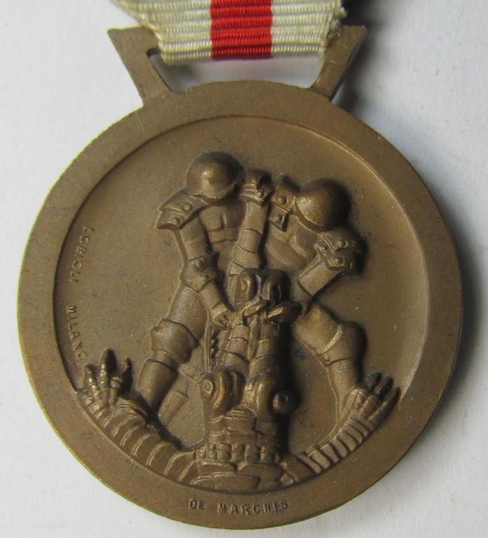 Superb, golden-bronze-coloured- (and I deem 'Buntmetall'-based-) example of a: 'Deutsch-Italienische Feldzugsmedaille' (or: German-Italian campaign medal) that comes mounted onto its (regular-sized) piece of original (albeit minimally faded) ribbon