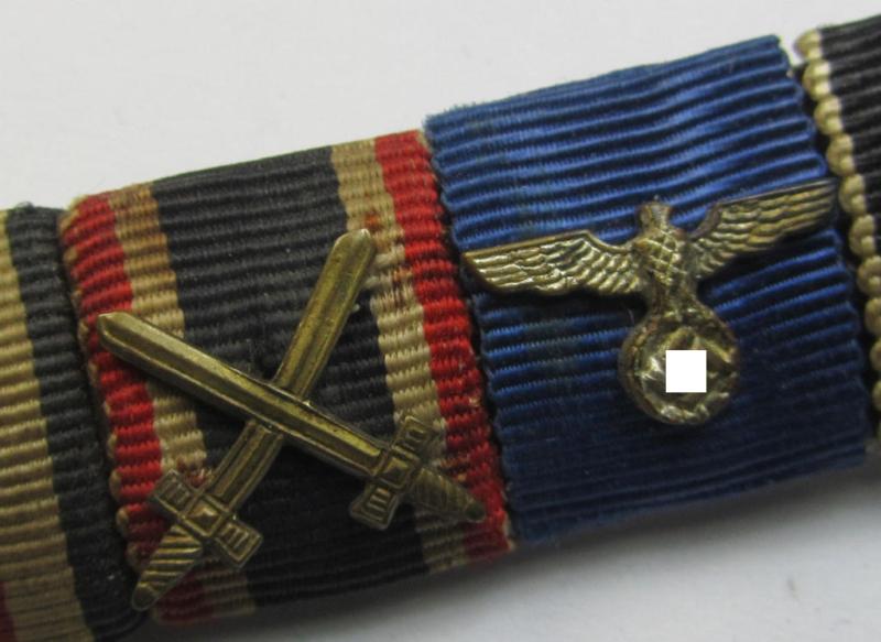 Neat, 5-pieced WH (Heeres etc.) medal-bar (ie. 'Feld- o. Bandspange') showing resp. the ribbons for an: 'EK II.Kl.', a: 'KvK II. Kl. m. Schw.', a: WH DA 4. St., a Czech 'Anschluss' medal and a: 'Luftschutz-Ehrenzeichen 2. St.'