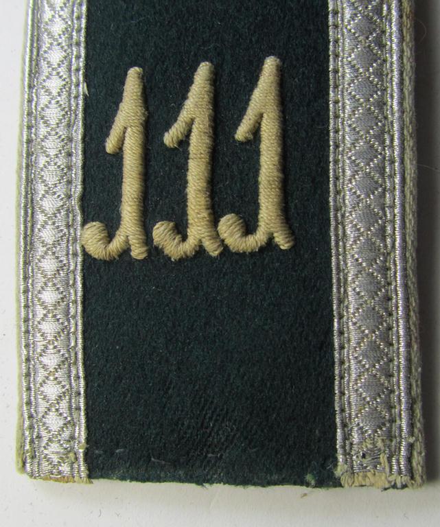 Single - and actually not that often seen! - WH (Heeres) EM-type (ie. 'M36-/M40'-pattern- and/or: 'rounded styled-') neatly 'cyphered' shoulderstrap as was intended for usage by an: 'Uffz. des Infanterie-Regiments 111'