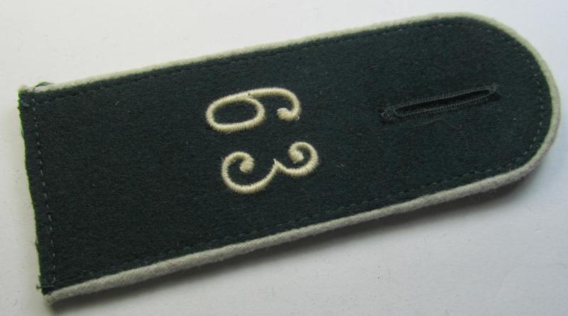 Single - and actually not that often seen! - WH (Heeres) EM-type (ie. 'M36-/M40'-pattern- and/or: 'rounded styled-') neatly 'cyphered' shoulderstrap as was intended for usage by a: 'Soldat des Infanterie-Regiments 63'