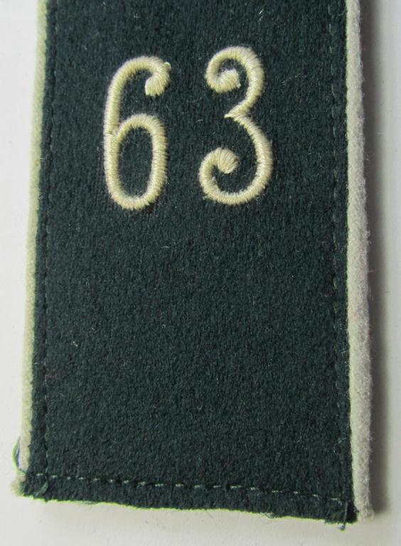 Single - and actually not that often seen! - WH (Heeres) EM-type (ie. 'M36-/M40'-pattern- and/or: 'rounded styled-') neatly 'cyphered' shoulderstrap as was intended for usage by a: 'Soldat des Infanterie-Regiments 63'