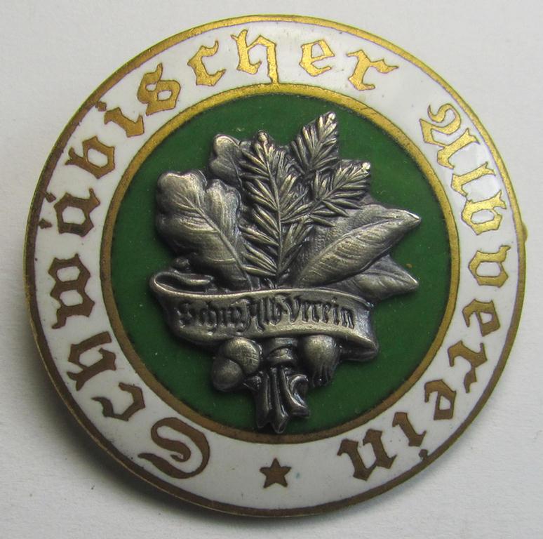 Interesting - and never before encountered! - neatly enamelled, commemorative membership lapel-pin as was intended for long-year membership within the: 'Schwäbischer Albverein' and that comes stored in its (period) circular-shaped etui (ie. box)