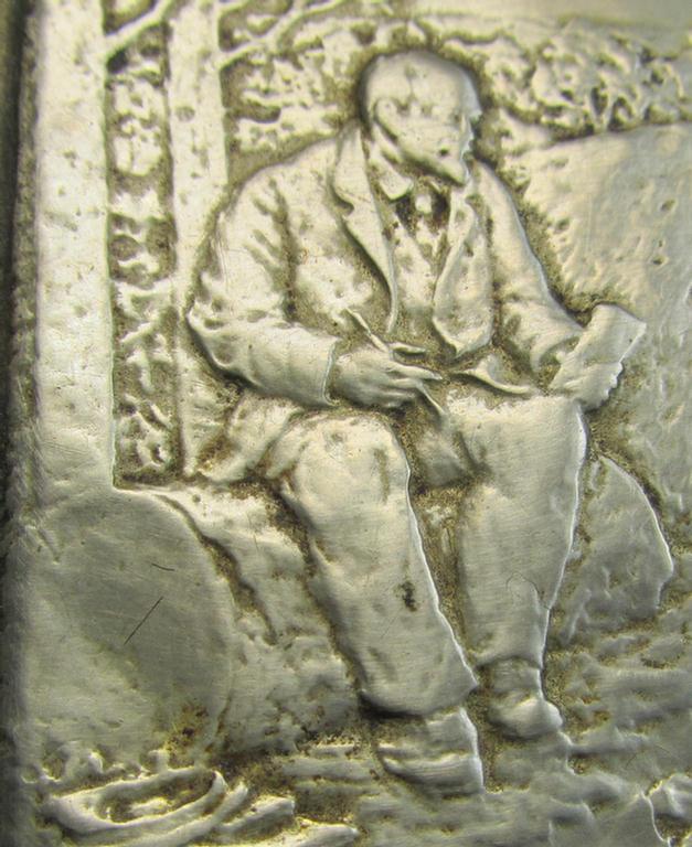 Unusal item that originated from a German soldier: a Russian, WWII-period, silver-toned tobacco-box showing a representation of Lenin coupled with some Cyrillic text (and that comes in a clearly used  condition)
