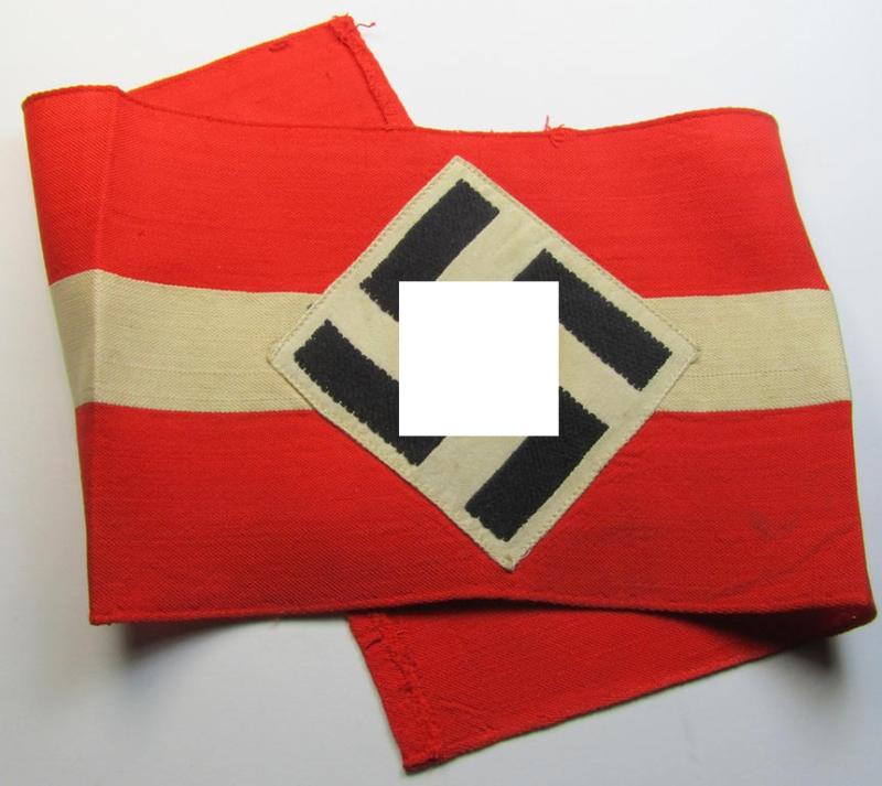 Attractive - and nowadays scarcely found! - 'standard'- (ie. entirely woven) pattern, bright-red-coloured HJ- (ie. 'Hitlerjugend'-) related armband (ie. 'Armbinde') being a moderately worn- ie. used example that regrettably misses its 'RzM'-etiket