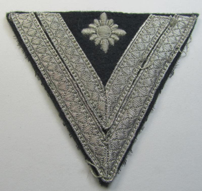 WH (Heeres) 'Armwinkel' (or: arm-chevron) as executed on typical darker-green-coloured wool as was specifically intended for usage by a soldier with the (unusually encountered!) rank of: 'Stabsgefreiter'