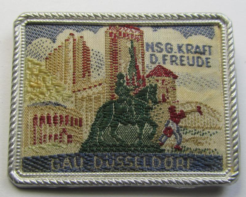 Commemorative - tin- (ie. linnen-) based-, 'DAF'/'KDF'- (ie. 'Deutsches Arbeits Front'-) related 'tinnie' being a non-maker-marked example depicting a towns'-view and text: 'NSG Kraft D. Freude - Gau Düsseldorf'