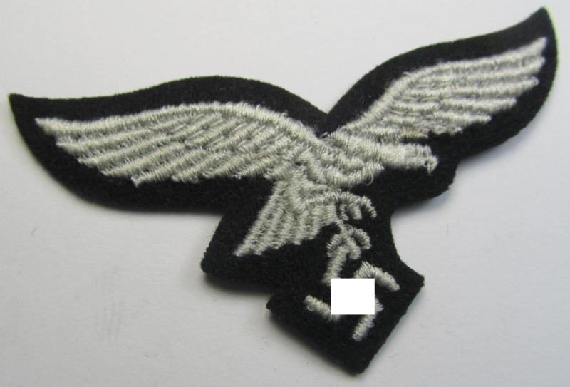 Attractive, WH (Luftwaffe) cap-eagle (being a 'standard-issue'-pattern example that is executed on a black-coloured background and that was as such intended for usage on the black-coloured work- ie. 'HG'-related side-caps ie. 'Schiffchen')