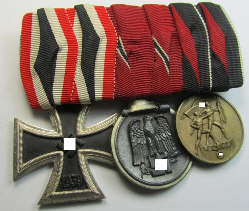 Superb, 3-pieced medal-bar (ie. 'Spange') showing resp. an: 'EK II. Klasse', an: 'Ost'-medal and a Czech 'Anschluss'- (ie. occupation-) medal: '1. Oktober 1938' that come period-mounted as a (detachable) 'Ordenspange'