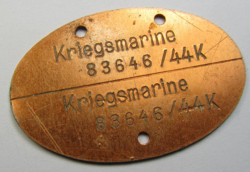 Later-war- (albeit 'standard-issue'-) pattern, WH (Kriegsmarine) typical aluminium-based- and/or reddish-bronze toned ID-disc (ie. 'Erkennungsmarke') bearing the engraved coded numeral (ie. text) that reads: 'Kriegsmarine 83646/44K'