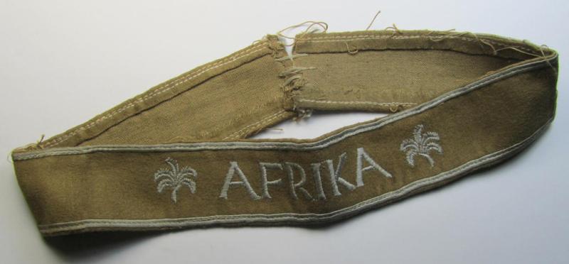 Attractive - and clearly worn! - WH cuff-title (ie. 'Ärmelstreifen') entitled: 'Afrika' (being an almost full-length example that comes in an overall very nice- ie. issued and clearly worn ie. once tunic-attached, condition)