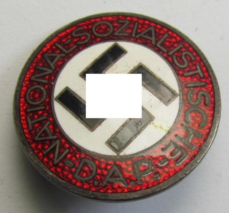 Attractive - darker-red-coloured and nicely preserved! - 'N.S.D.A.P.'-membership-pin- ie. party-badge (or: 'Parteiabzeichen') which is maker-marked on the back with the makers'-designation: 'RzM' and/or: 'M1/102'