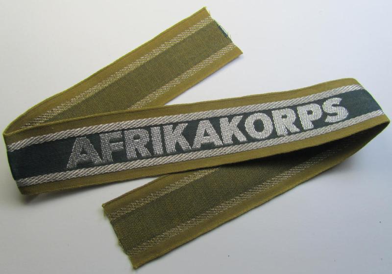 Superb, 'BeVo'-like cuff-title (ie. 'Ärmelstreifen') entitled: 'Afrikakorps' being a presumably issued but never worn example that comes in an overall very nice- (ie. non-shortened- and never tunic-attached-), condition