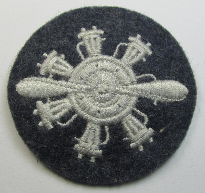 Machine-embroidered, WH (Luftwaffe) trade- ie. special-career-patch (ie. 'Laufbahn- o. Tätigkeitsabzeichen') as was specifically intended for a: 'Geräteverwalter (Flzg.)' and that comes in a 'virtually mint' and/or never tunic-attached, condition