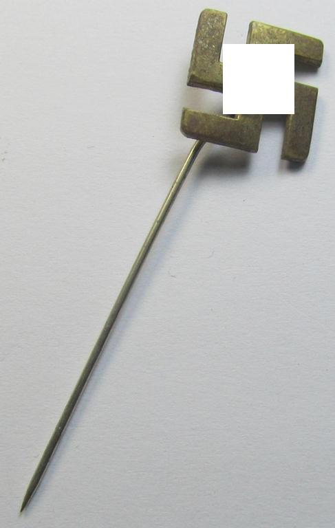Unusually seen, golden-coloured (and - I deem - typical 'Buntmetall'-based) so-called: patriotic swastika lapel-pin (ie. 'N.S.D.A.P.-supportive piece) being an example that comes mounted onto its long-sized pin