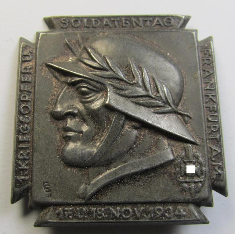 Commemorative, silver-toned and/or tin-based: 'N.S.K.O.V.'-related 'tinnie' being a non-maker-marked example showing a soldier wearing a steelhelmet coupled with the text: '1. Kriegsopfer u. Soldatentag - 17. u. 18. November 1934 - Frankfurt a. M.'