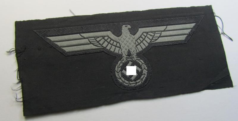 Later- (ie. mid-war-) period, WH (Heeres) 'Panzer'-type breast-eagle (ie. 'Brustadler für Panzertruppen') being a 'virtually mint- ie. unissued' example as executed in bluish-grey-coloured linnen on a black-coloured background