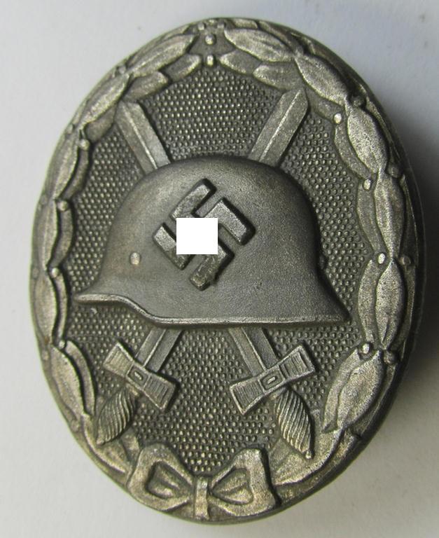 Attractive, silver-class woundbadge (or: 'Verwundeten Abzeichen in Silber') being a nicely maker- (ie. '107'-) marked example (as was produced by the desirable 'Hersteller' ie. maker: 'Carl Wild')