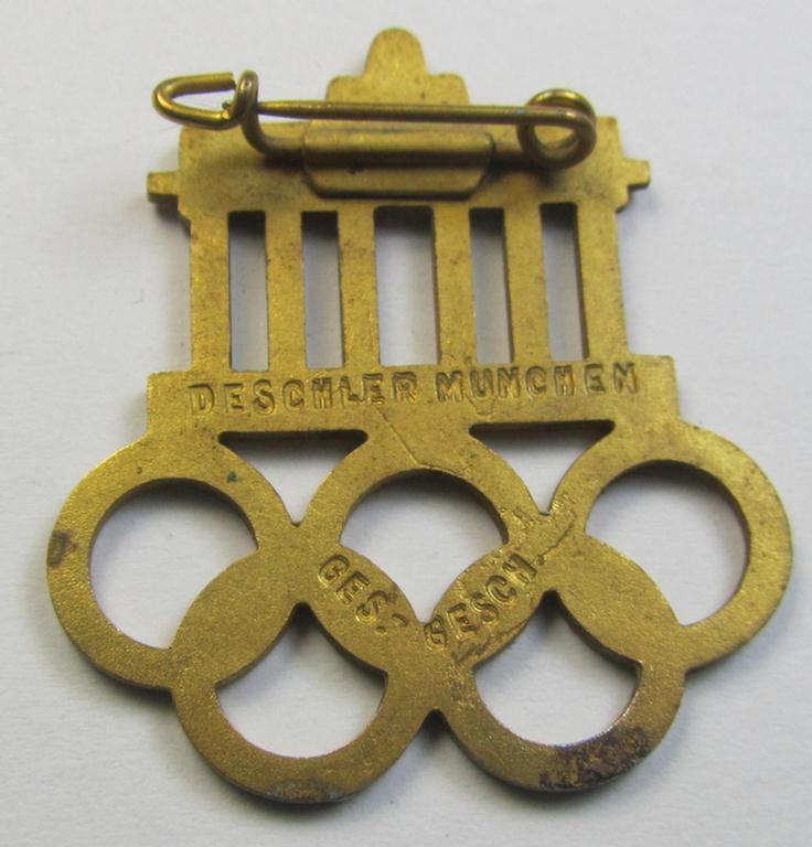 Commemorative - and neatly enamelled! - 'Veranstaltungsabzeichen' being a maker- (ie. 'Deschler'-) marked example that is showing the Olympic rings above an illustration of the: 'Reichstag' coupled with the text: 'XI. Olympiade Berlin 1936'