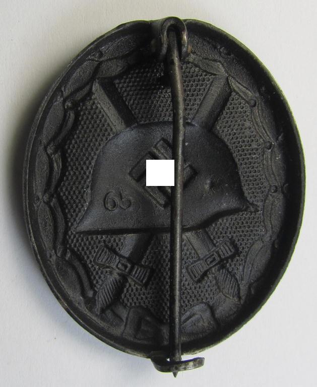 Neat - albeit clearly used- and/or worn! - maker- (ie. '65'-) marked example of a black-class wound-badge (or: 'Verwundeten-Abzeichen in Schwarz') being an example that was produced by the maker (ie. 'Hersteller') named: 'Klein & Quenzer'