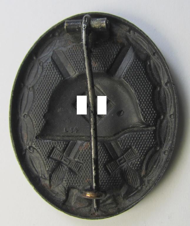 Attractive - and moderately used - neatly maker- (ie. 'L/54'-) marked example of a black-class wound-badge (or: 'Verwundeten-Abzeichen in Schwarz') being an example that was produced by the maker (ie. 'Hersteller') named: 'Schauerte u. Höhfeld'