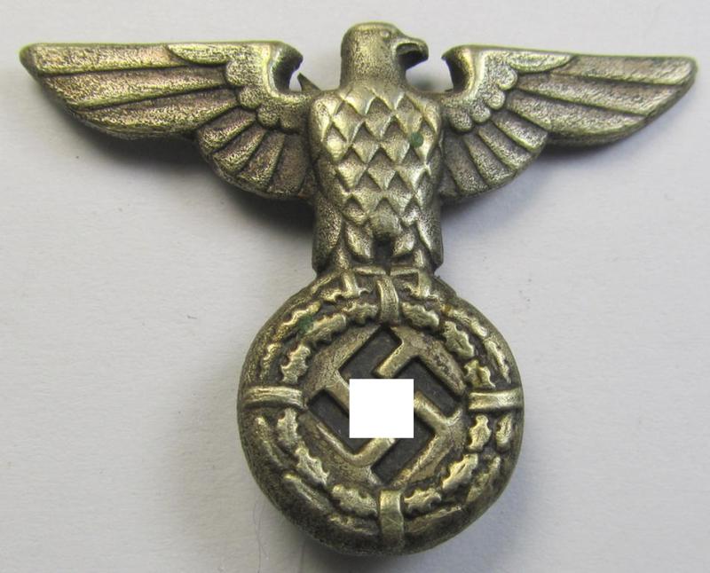 Silver-toned - and I deem 'Buntmetall'-based - early-pattern, SS- o. SA-type, political-style visor- (ie. 'Schirmmützen'-) cap-eagle being a clearly maker- (ie. 'RzM M1/25'-) marked example that comes in a used- ie. carefully cap-removed-, condition