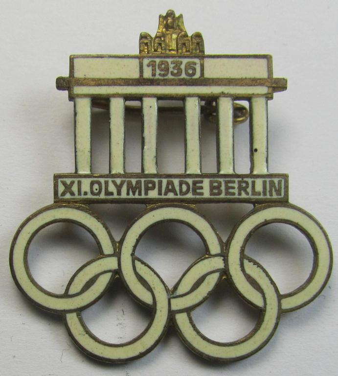 Commemorative - and neatly enamelled! - 'Veranstaltungsabzeichen' being a maker- (ie. 'W.D.'-) marked example that is showing the Olympic rings above an illustration of the: 'Reichstag' coupled with the text: 'XI. Olympiade Berlin 1936'