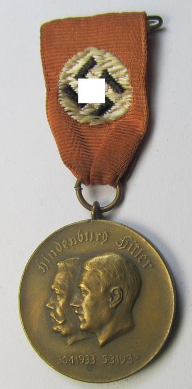 Superb, bronze-toned commemorative-medal (ie. 'Erinnerungs-Medaille') entitled: 'Hindenburg - Hitler - 30.1.1933 - 5.3.1933' and that comes mounted onto its period ribbon showing an interwoven swastika