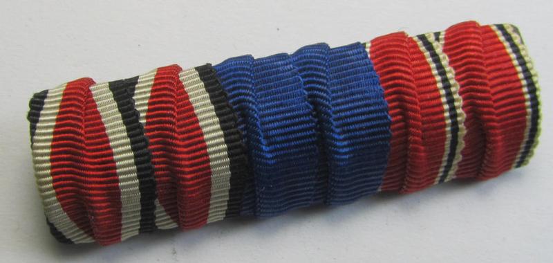 Three-pieced ribbon-bar (ie. 'Band- o. Feldspange') depicting respectively the ribbons an: 'Eisernes Kreuz II. Klasse' (or: iron cross second class), a: WH (Heeres) 'DA-4. Stufe' and a: Austrian 'Anschluss'-medal: '1 März 1938'