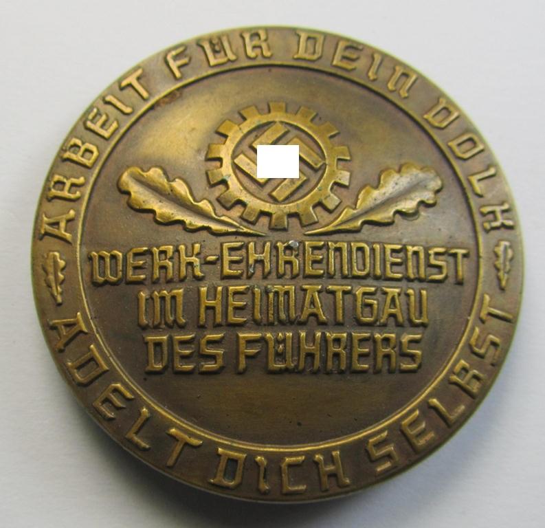 Superb - and unusually seen! - commemorative DAF- (ie. 'Deutsches Arbeitsfront') related day-badge (ie. 'tinnie') being a maker- (ie. 'HuW'-) marked example entitled: 'Werk-Ehrendienst im Heimatsgau des Führers'